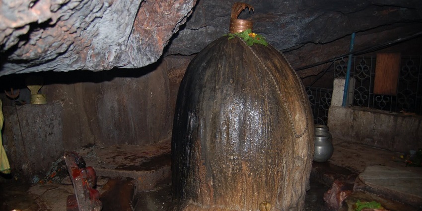 Gupteshwara Shiva-lingam inside a cave with intricate carvings and a picnic place in odisha.