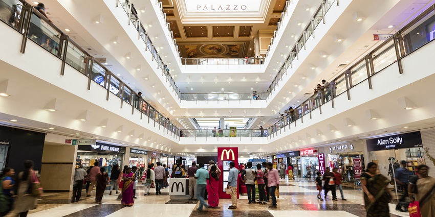 View of shops inside the halls of Select Citywalk Mall with people wandering around
