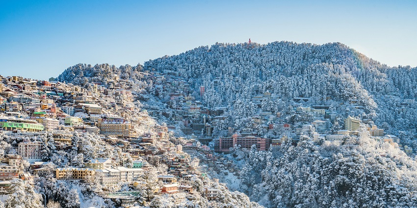 Beautiful buildings on the hills covered in desne thick snow in winters
