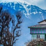 Scenic view of the Himalayas from Nakthan Village, Himachal Pradesh, showcasing majestic peaks.