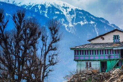 Scenic view of the Himalayas from Nakthan Village, Himachal Pradesh, showcasing majestic peaks.