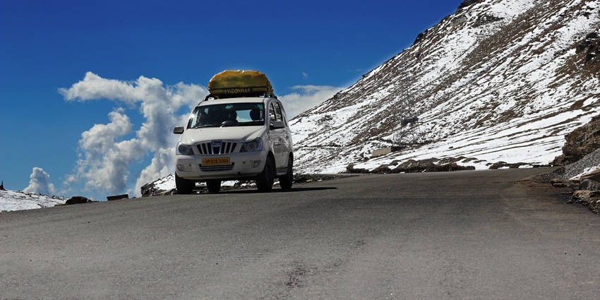 Winding through rugged terrain with breathtaking mountain views and scenic landscapes.