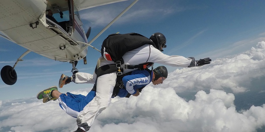 Tandem skydiving experience with an instructor and a passenger diving together