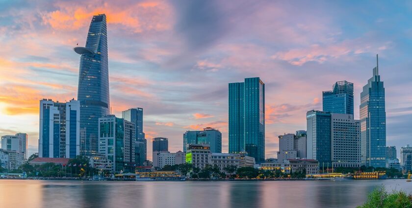 A scenic view of towering buildings surrounded by glistening waters of the region.