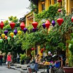 Beautiful image the street of Hoi An laden with the lamps and Flowers– Hoi An nightlife