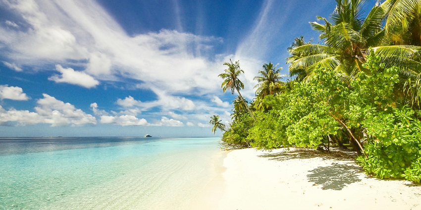 A breathtaking vista of shimmering waters meeting the golden sands at Hope Island.