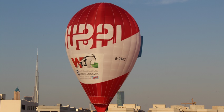 Enjoy the hot air balloon rides over the Dubai desert at sunrise with your partner.