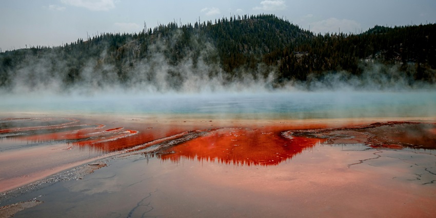 Picture of the beautiful natural hot water spring amidst the foothills of a Mountain