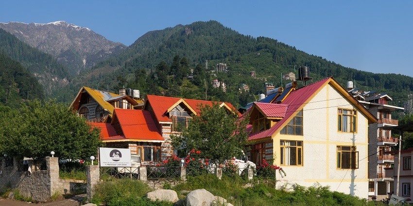 Snapshot of an idyllic cottage in the hills amidst the levish greenery of Himachal