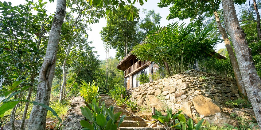 Beautiful image of a hotel admit the forest around the beautiful Jakrem hot springs
