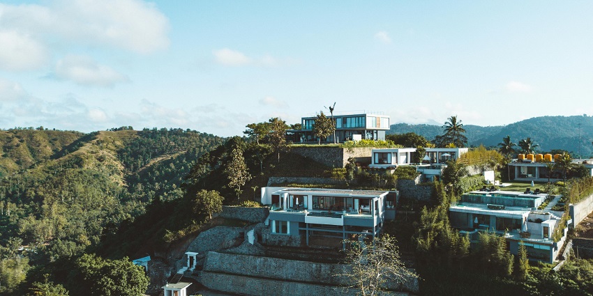 Beautiful image of the hotel amidst the hills surrounded by lush green forest