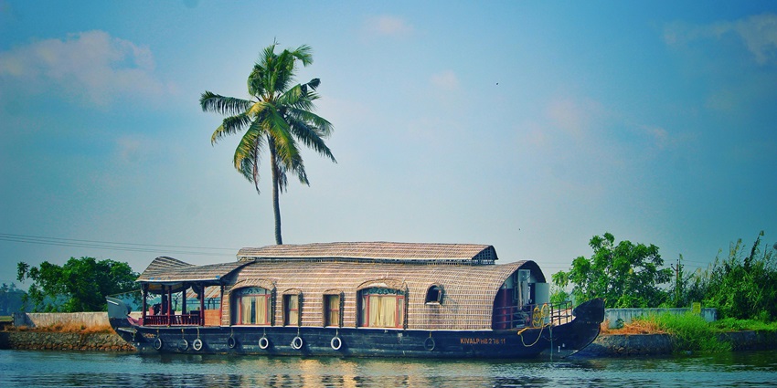 Image of a Houseboat on river among exotic nature in Kerala - explore Thirunelli temple