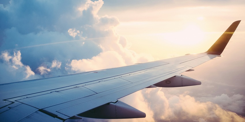 A breathtaking view from an aeroplane’s window of dense clouds during the daytime.