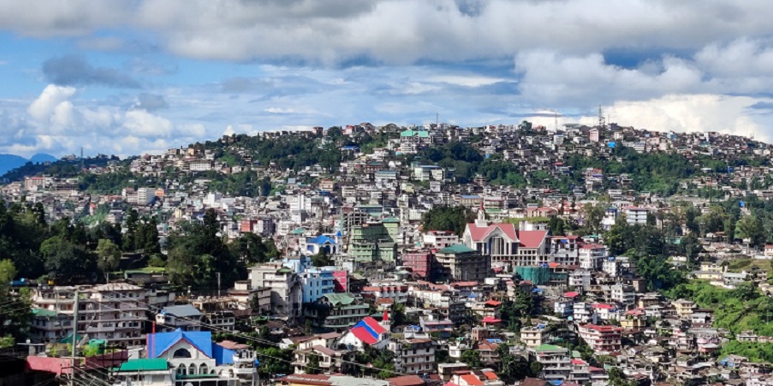 A picture of a town taken from a hill showing the complete cityscape
