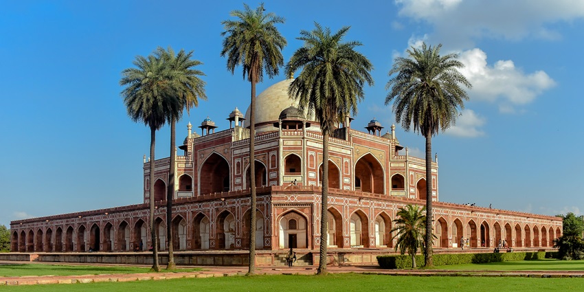 An amazing view of Humayun’s Tomb surrounded by lush greenery during the daytime.