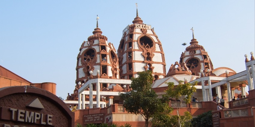 A picture of a Krishna temple in Delhi taken from outside having traditional architecture and intricate design