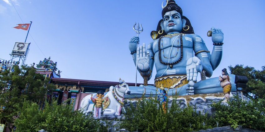 A detailed statue of Shiva, showcasing intricate carvings and a serene expression.