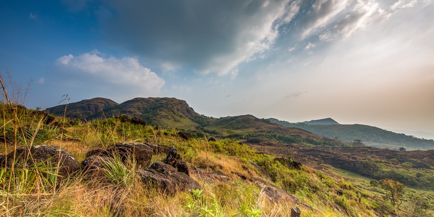Aerial view of the steep valleys of Ilaveezha Poonchira with a meander flowing through it