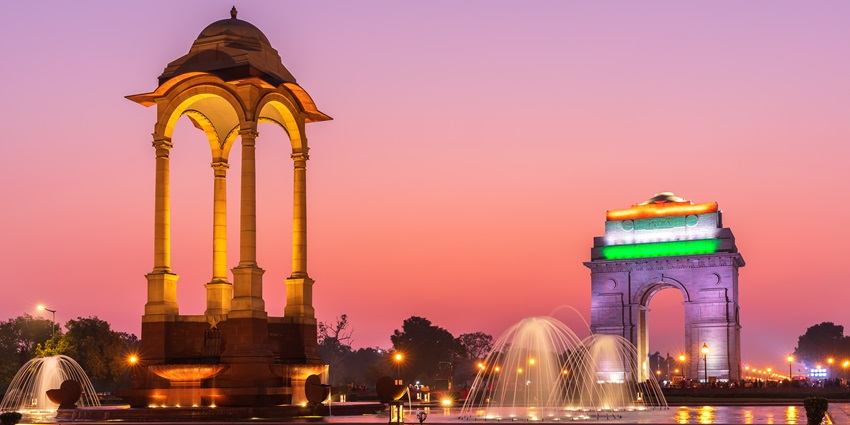 A breathtaking view of India Gate under dense clouds during the daytime to explore.