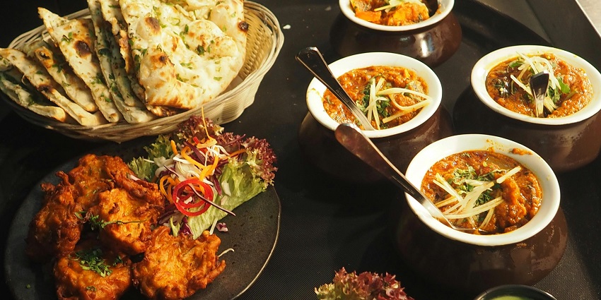 White and brown cooked dish served in white ceramic bowls, showcasing appetizing meals.