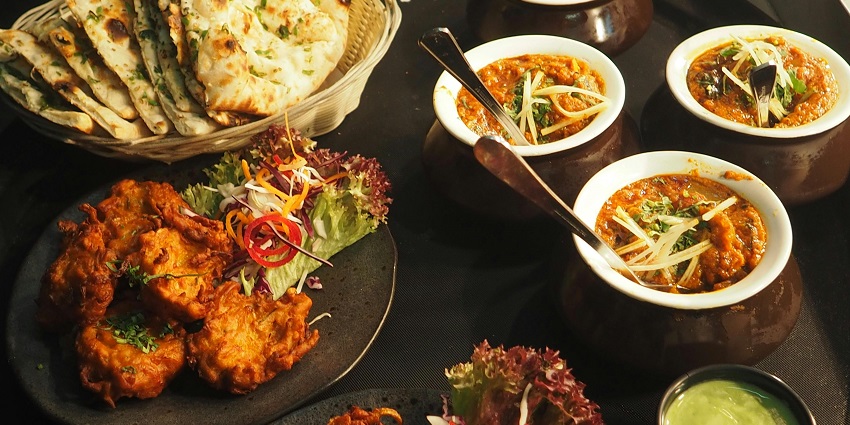 A delicious white and brown dish served in elegant white ceramic bowls.