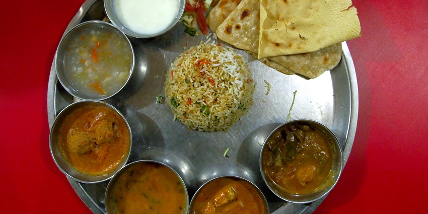 Enjoy traditional Indian thali, a delicacy, during your trip to Darjeeling zoo.