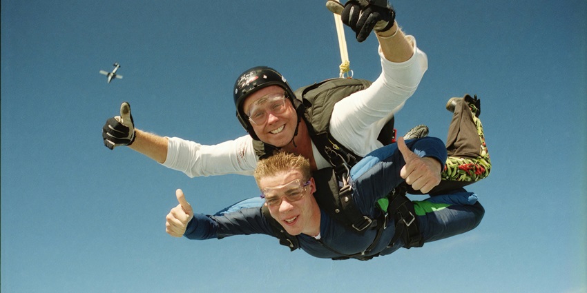 Snapshot of diver and the pillion trainer skydiving together in the facility in Singapore