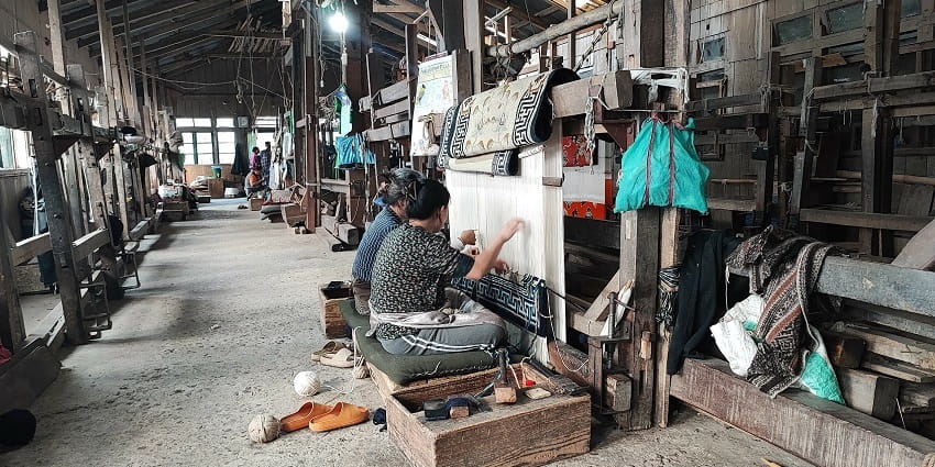 Tibetan Refugee Self Help Centre with artisans crafting traditional Tibetan goods and showcasing cultural heritage.