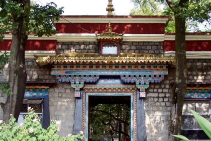 An enchanting outer view of the institute with a staircase leading to the top.