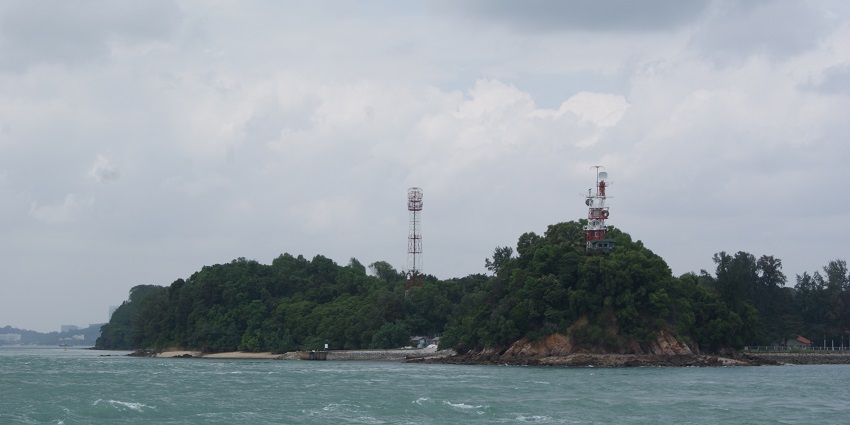 Ferries are available to the island - Clear waters, and greenery, seen from above.