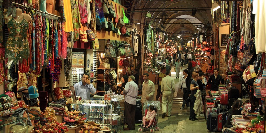 A picture of a bustling market in Silchar with numerous stalls and shoppers