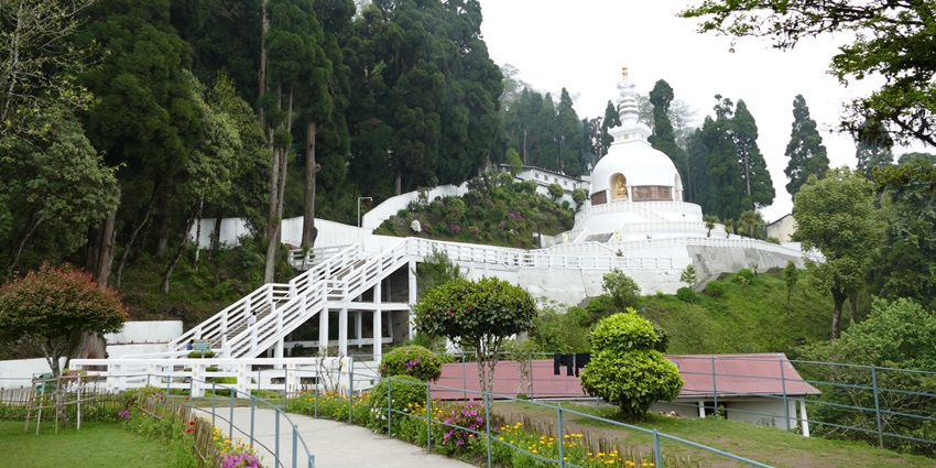 A brimming white-coloured Japanese Peace Pagoda, a significant landmark in Darjeeling.