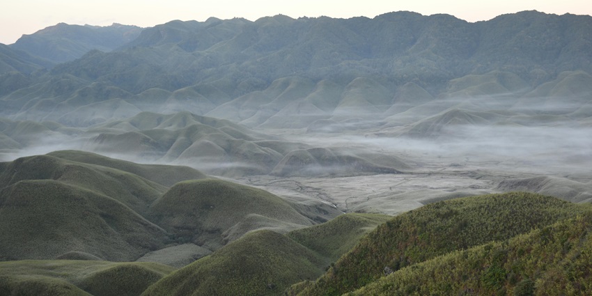 A serene vista of Japfu Peak, a scenic place to explore near Dzukou Valley in April.
