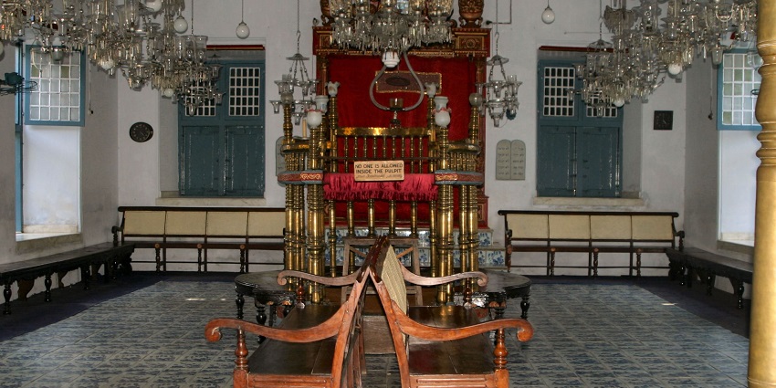 An inside view of the Jewish Synagogue, featuring vintage designs and rustic accents.