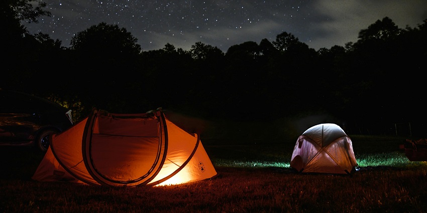 Image of two camp tent at night view under beautiful and shining star and around lush forest