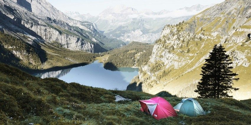 A mesmerising view of green-capped mountains and lush green valleys and serene lakes.
