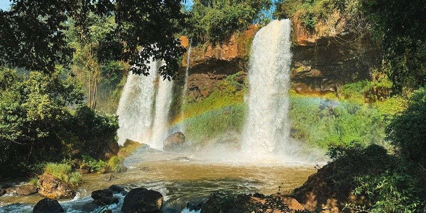 A quaint view of shimmering waterfalls, one of the best spots for camping in Jibhi.