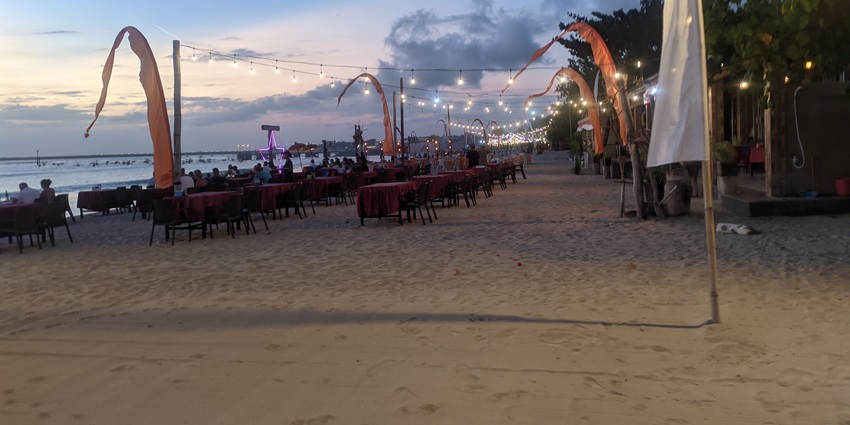 Beautiful image of the beach restaurant on thee Jimbaran beach a sea facing outdoor eatery