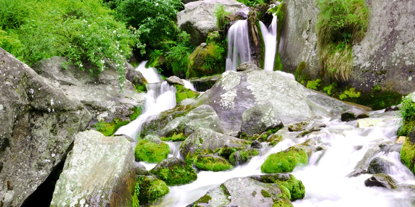 A picture of a slowly cascading waterfall in Vashisht which is one of the best places to visit in Manali for couples
