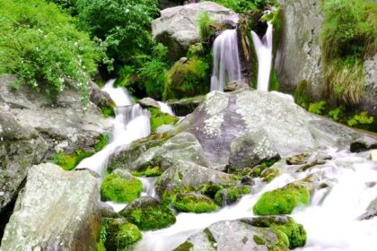 Panoramic image of the beautiful Jogini waterfalls amidst the lap of Himalaya