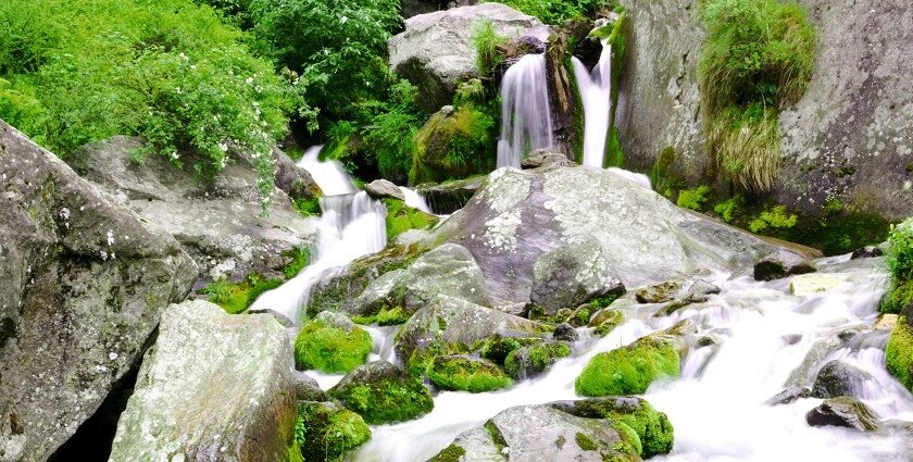 Panoramic image of the beautiful Jogini waterfalls amidst the lap of Himalaya