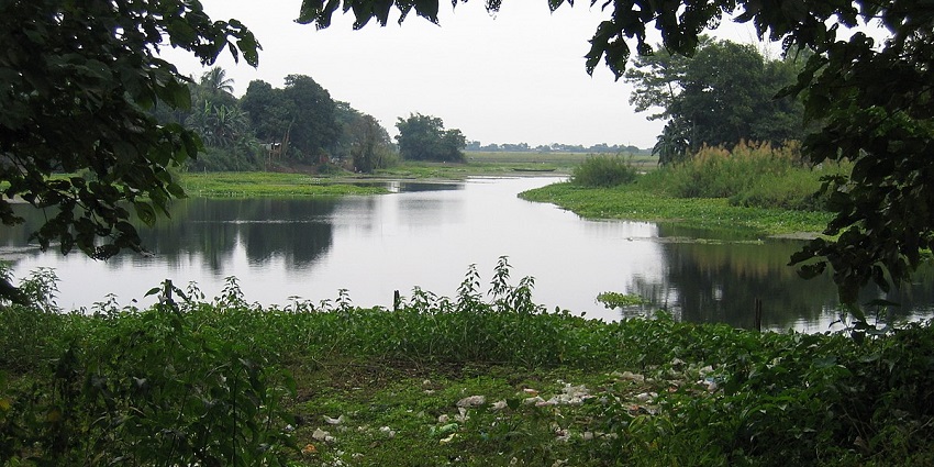 Serene waters and greenery of Jugibil, one of the scenic Golaghat picnic places.