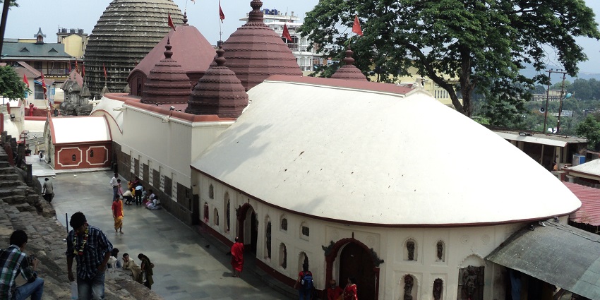 An image of Kamakhya Temple with a mystical aura under a dark sky located in Assam.