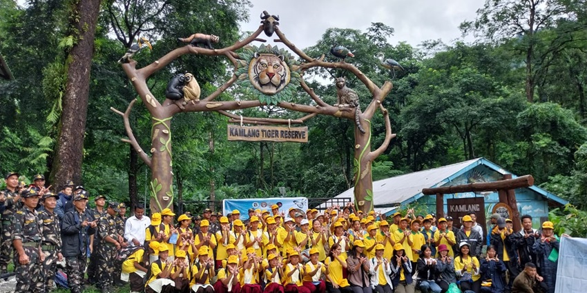 A picture of the entrance of a wildlife sanctuary, surrounded by lush greenery