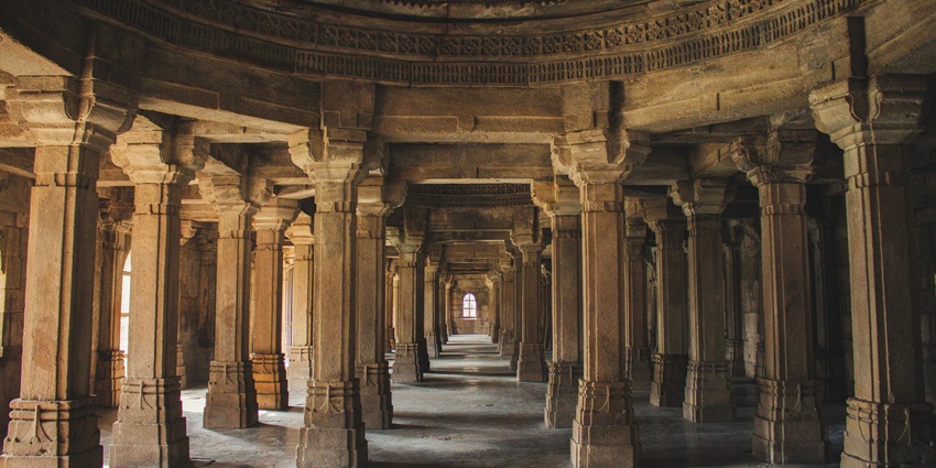 Majestic brown concrete columns showcasing architectural beauty and history.