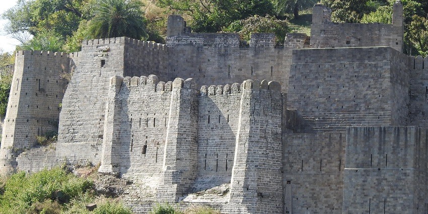 A view of the iconic Kangra Fort, a famous tourist attraction in Himachal Pradesh.