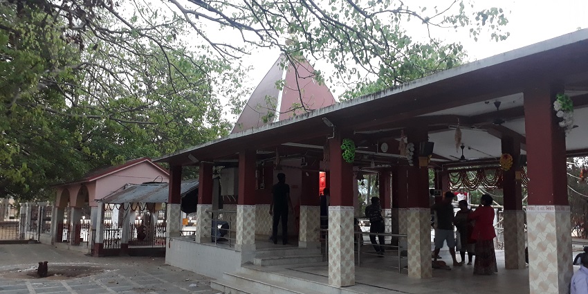 Kali Mandir, an ornate temple surrounded by greenery and traditional sculptures.