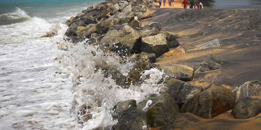 A mesmerising view of waves striking the rocks at the sea shore at the Kappil Beach
