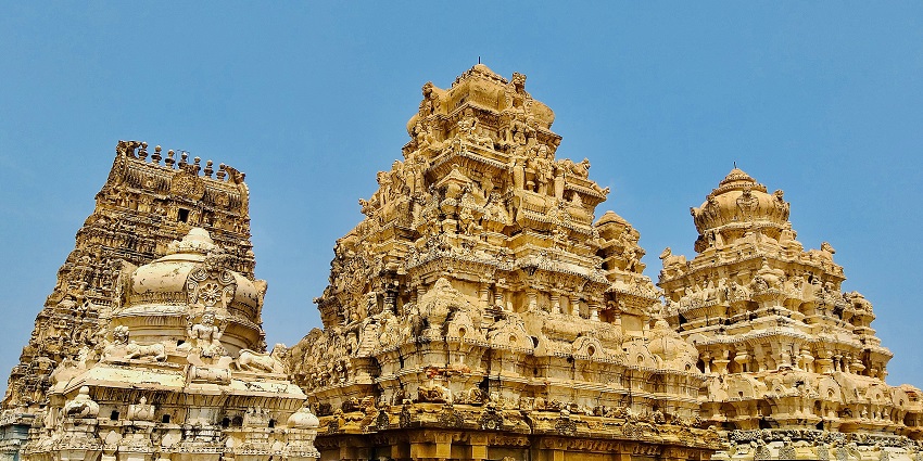 A picture of a holy place of worship with intricate carvings & amazing architecture.