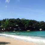 A mesmerising view of turquoise waters and lush green landscapes in Phuket, Thailand.